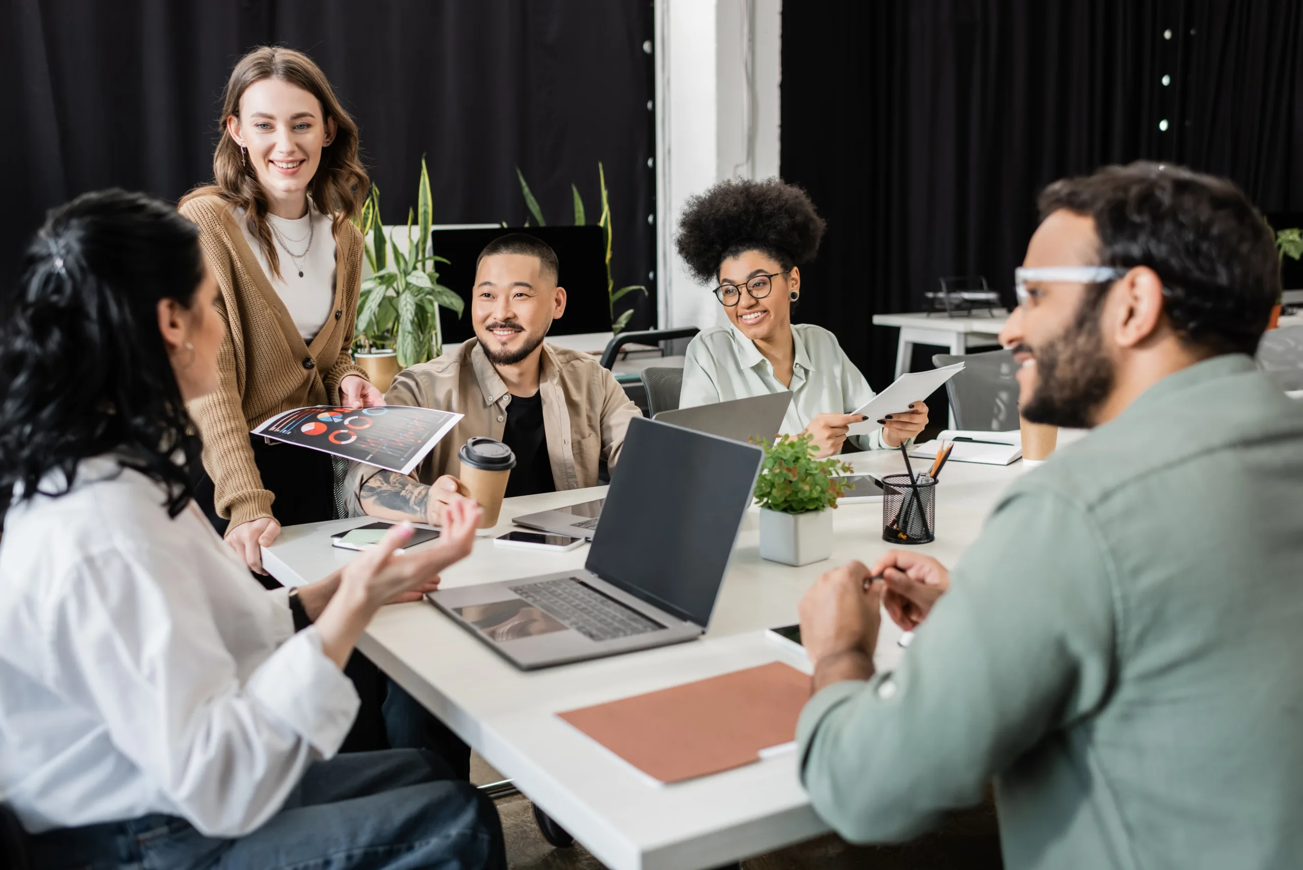 group of colleagues sitting around a table